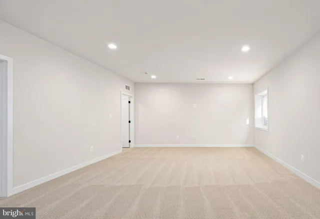 a bathroom with a sink a toilet a mirror and shower curtain