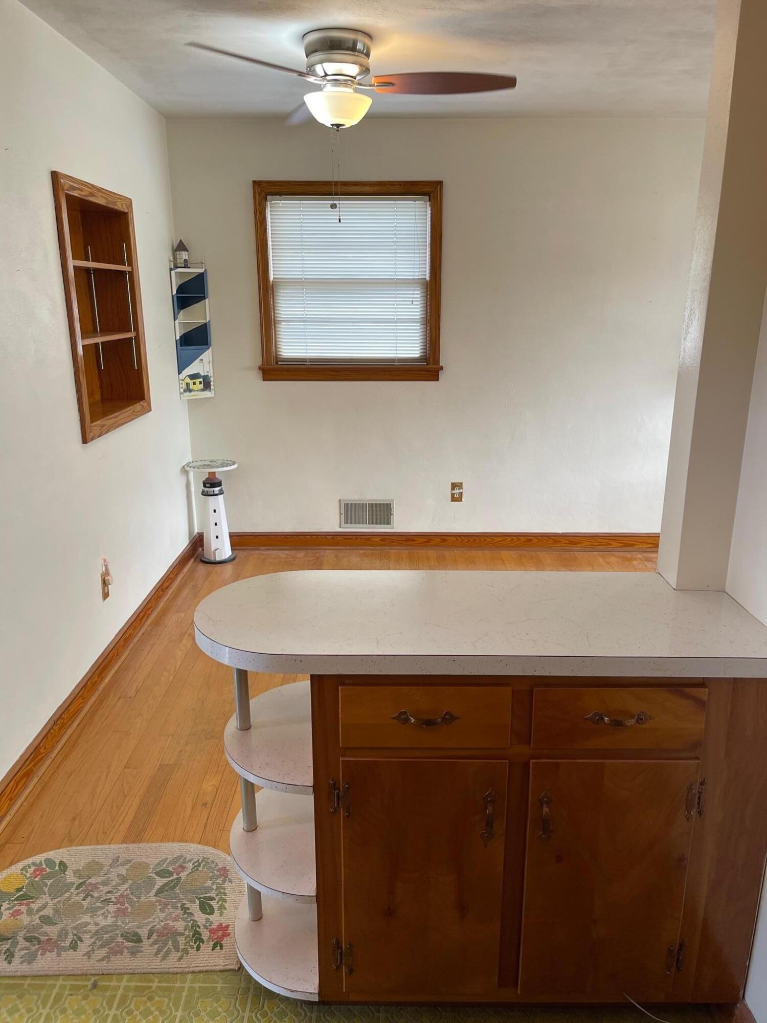 516 Mapleton Avenue Northeast Roanoke, VA 24012 - Photo 12 of 21 a bathroom with a sink and a mirror