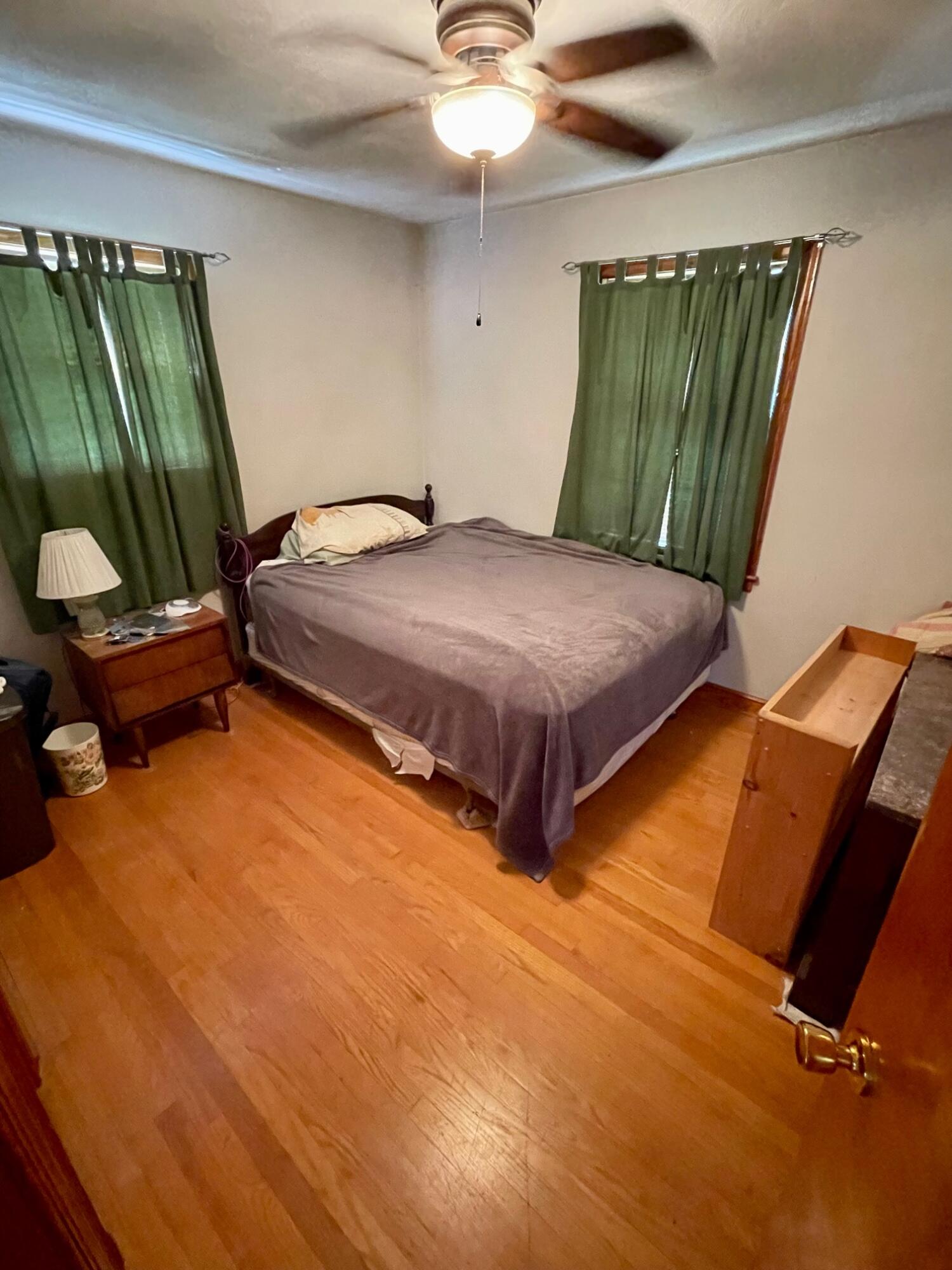 516 Mapleton Avenue Northeast Roanoke, VA 24012 - Photo 17 of 21 a bedroom with a bed and a chandelier