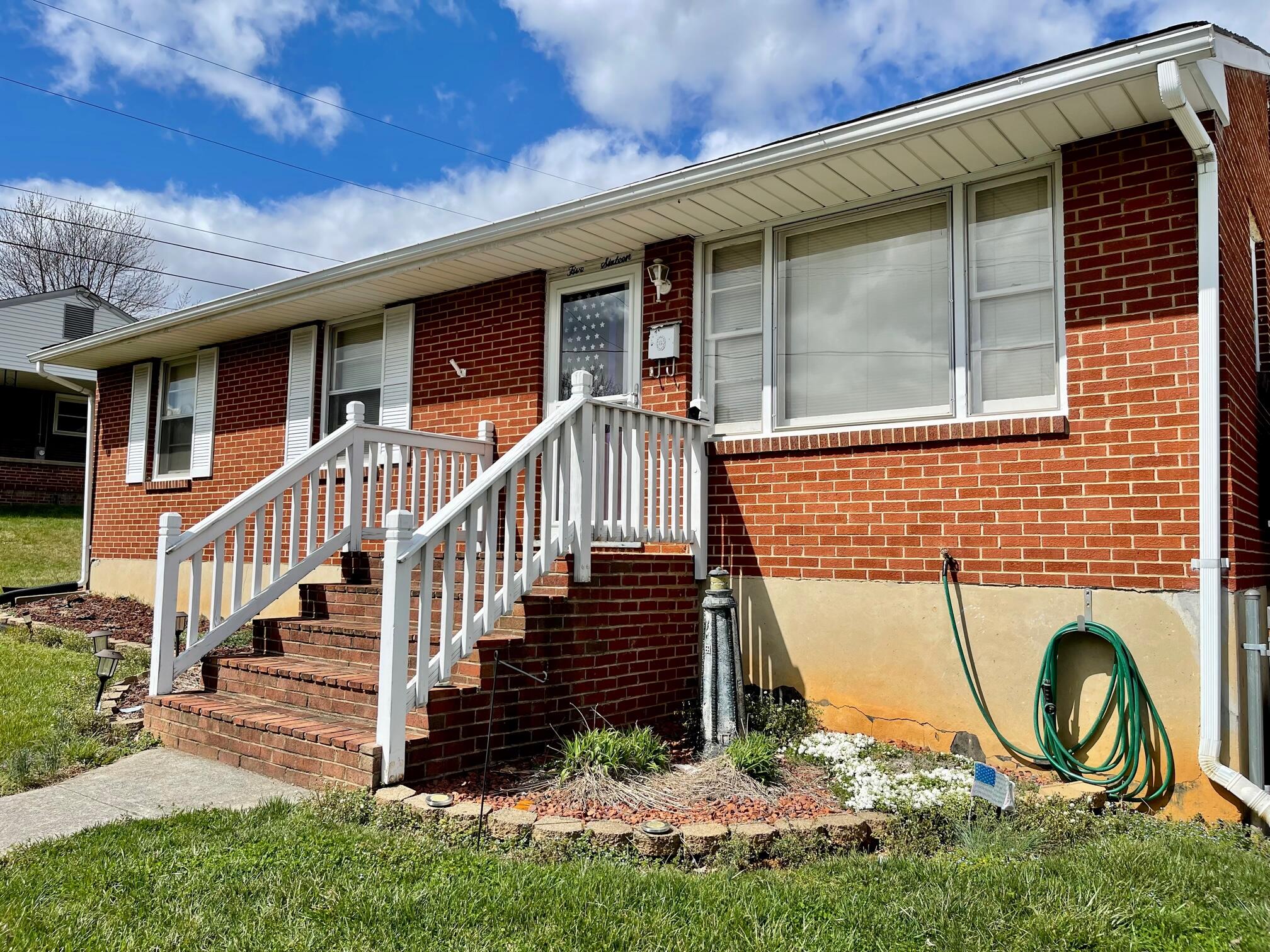 516 Mapleton Avenue Northeast Roanoke, VA 24012 - Photo 2 of 21 a front view of a house with a yard