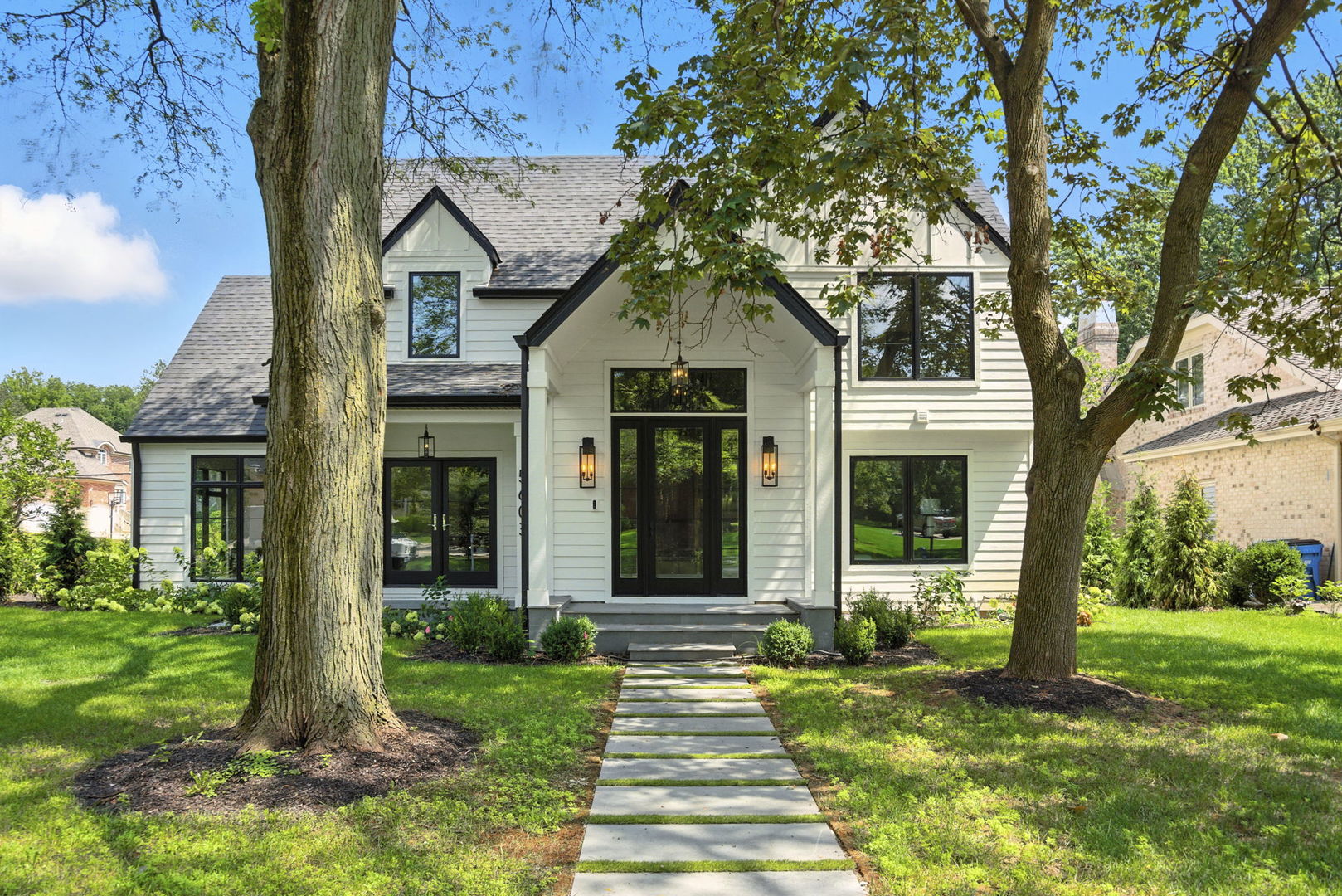 a front view of a house with garden