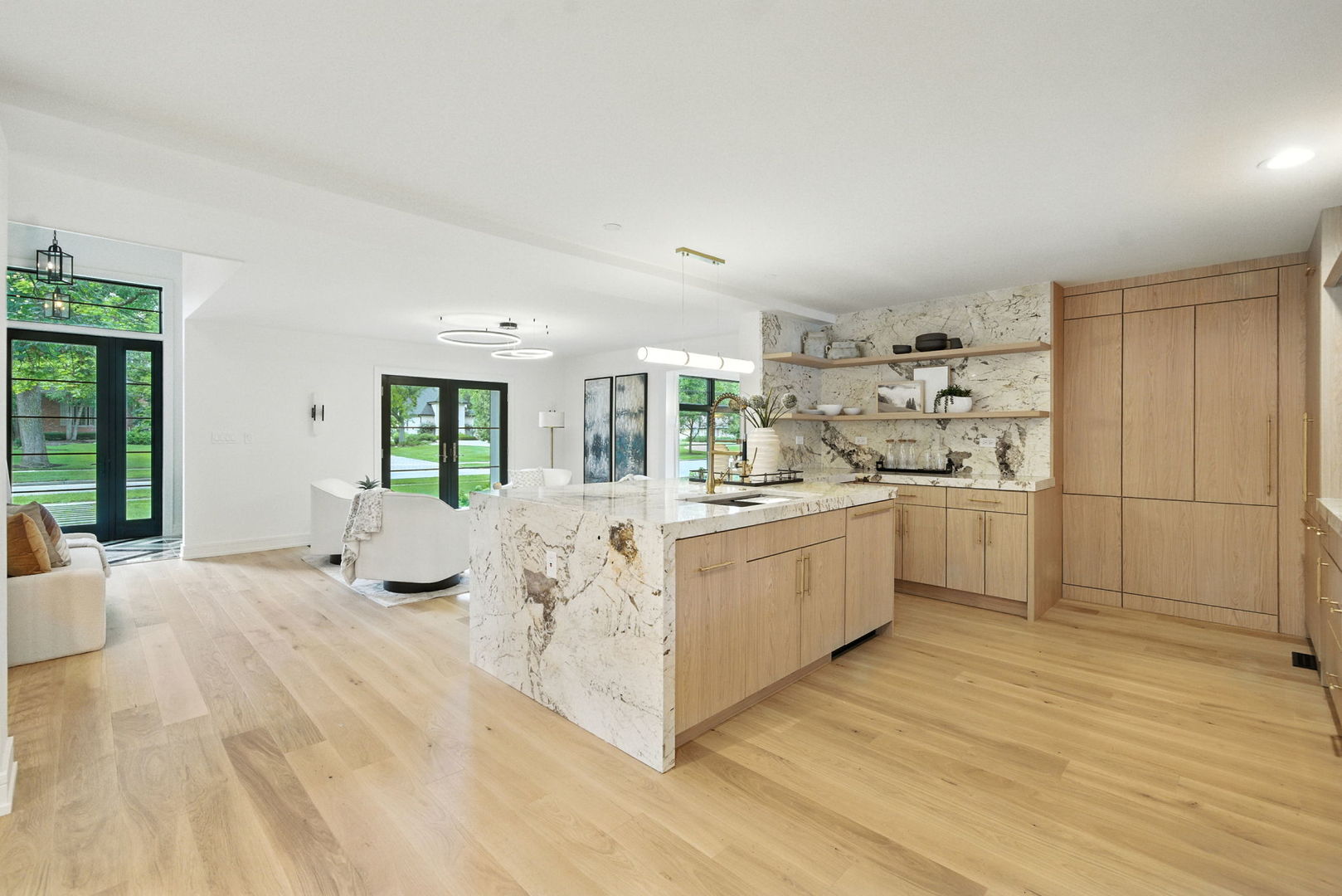 5603 South Garfield Street Hinsdale, IL 60521 - Photo 17 of 67 a large white room with kitchen island a sink a counter space and stainless steel appliances