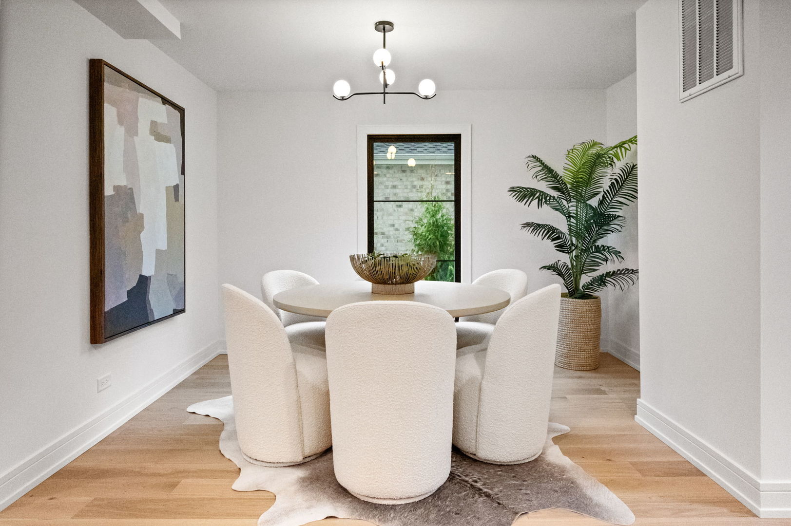 5603 South Garfield Street Hinsdale, IL 60521 - Photo 27 of 67 a dining room with furniture potted plants and wooden floor
