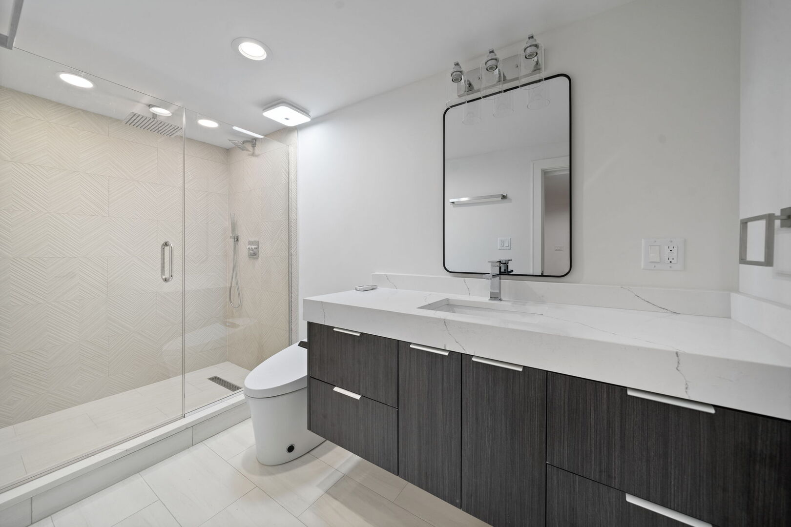 5603 South Garfield Street Hinsdale, IL 60521 - Photo 30 of 67 a bathroom with a sink a toilet and shower