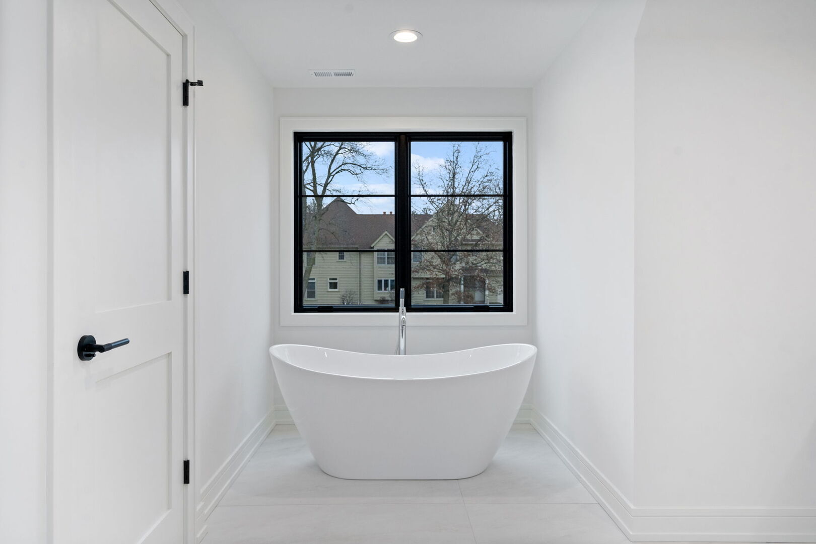 5603 South Garfield Street Hinsdale, IL 60521 - Photo 36 of 67 a white bath tub sitting in a bathroom