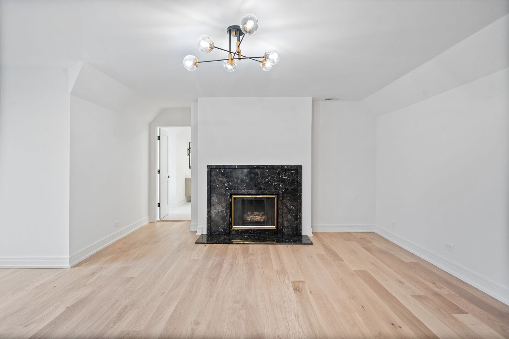 5603 South Garfield Street Hinsdale, IL 60521 - Photo 40 of 67 a view of an empty room with wooden floor fireplace and a window