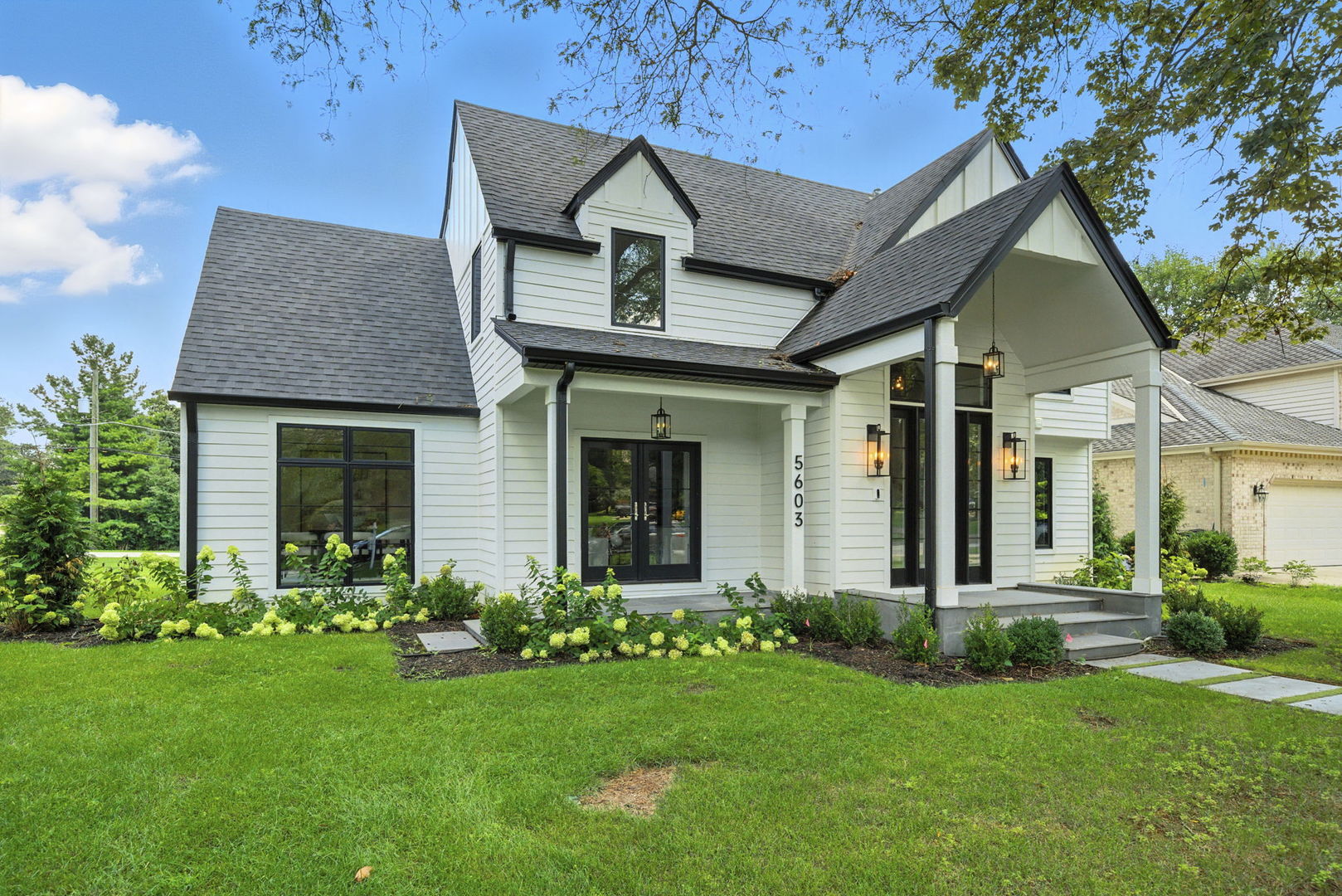 5603 South Garfield Street Hinsdale, IL 60521 - Photo 58 of 67 a front view of a house with a garden and plants