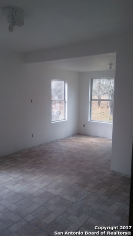 23717 Wood Park, Unit 3 San Antonio, TX 78264 - Photo 5 of 18 an empty room with windows