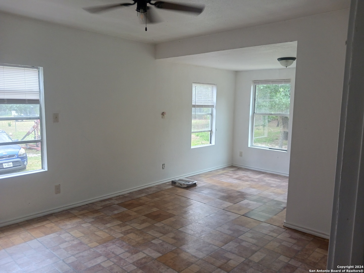 23717 Wood Park, Unit 3 San Antonio, TX 78264 - Photo 7 of 18 an empty room with windows