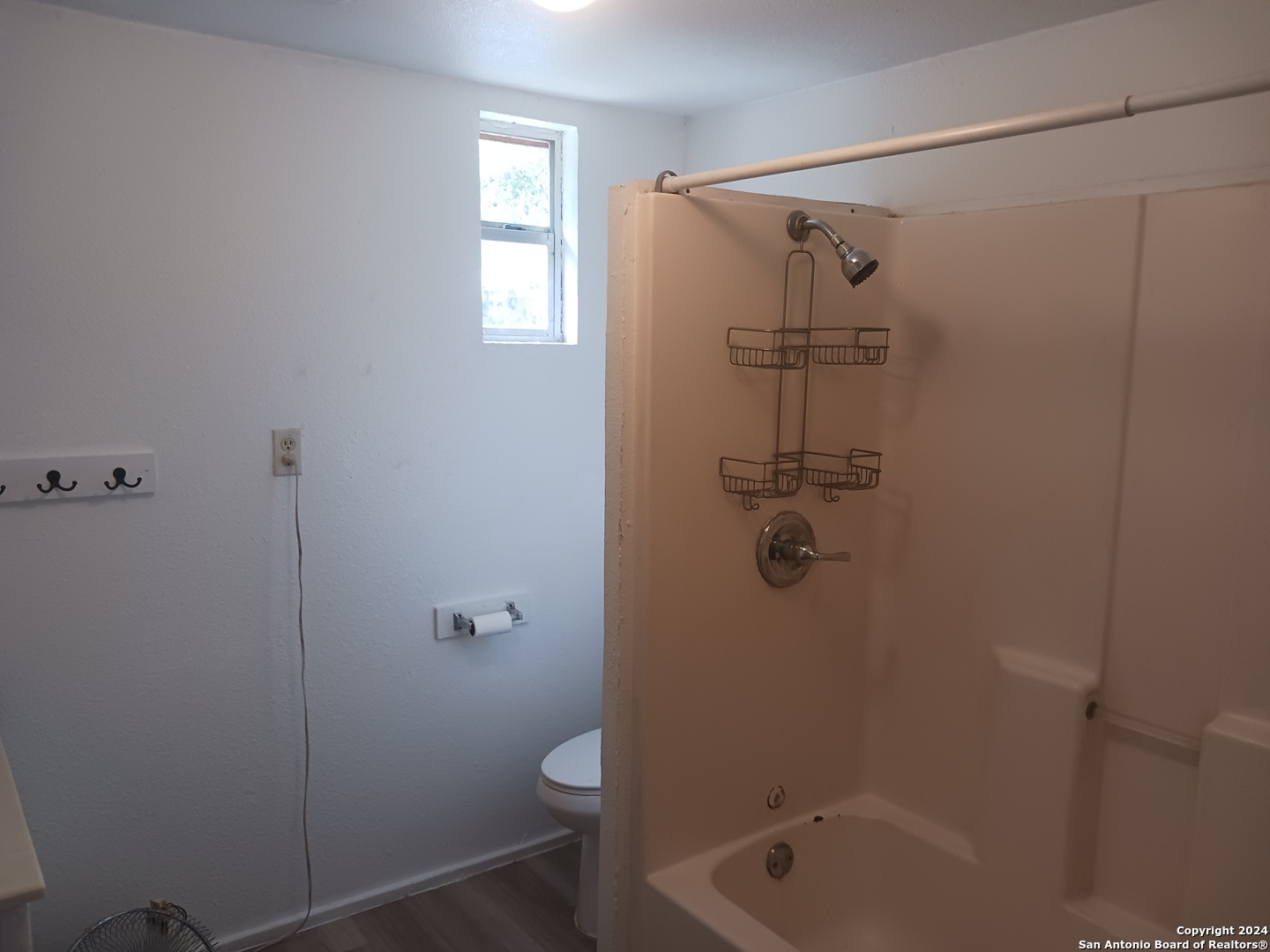 23717 Wood Park, Unit 3 San Antonio, TX 78264 - Photo 8 of 18 a bathroom with a shower a toilet and sink