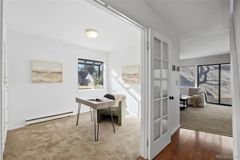 a view of a livingroom with furniture and windows