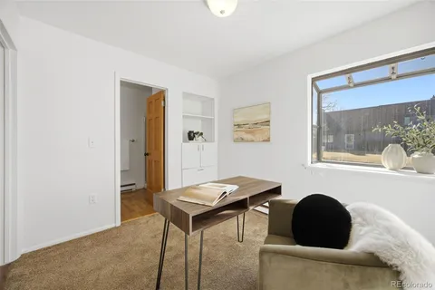 a living room with a couch and a window