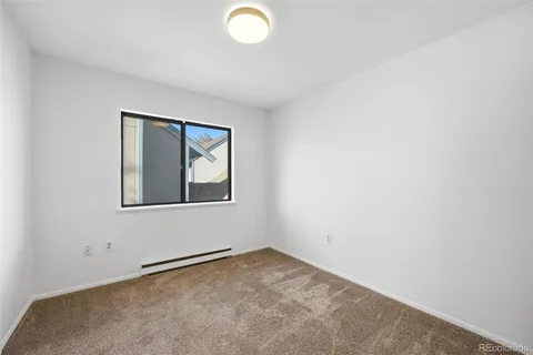 a bathroom with a sink toilet and a mirror