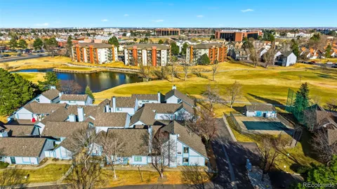 an aerial view of multiple house with yard