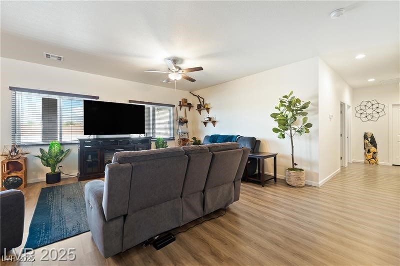 760 Fort Churchill Road Pahrump, NV 89060 - Photo 10 of 33 Living area featuring light wood finished floors and a ceiling fan