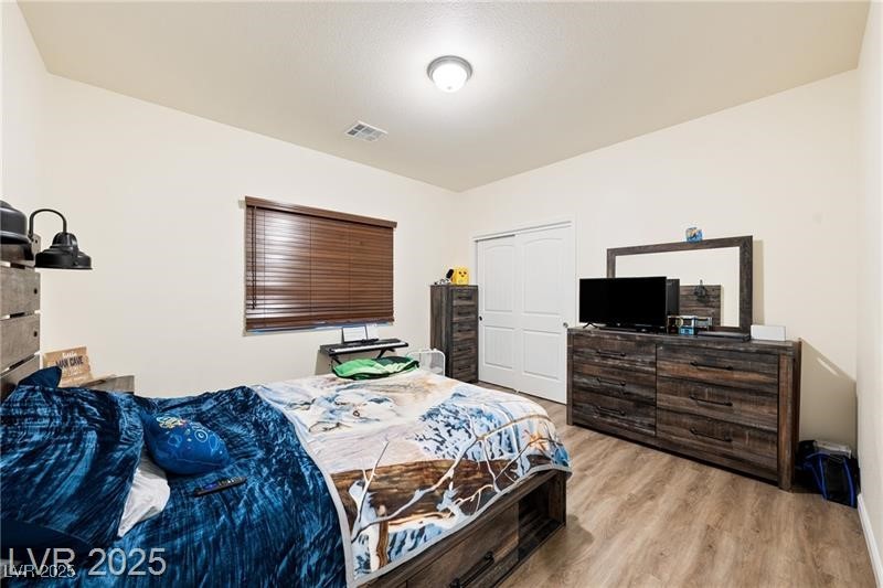 760 Fort Churchill Road Pahrump, NV 89060 - Photo 20 of 33 Bedroom with light wood-style flooring