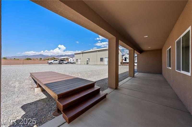 760 Fort Churchill Road Pahrump, NV 89060 - Photo 30 of 33 View of patio / terrace featuring a mountain view
