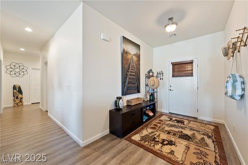 760 Fort Churchill Road Pahrump, NV 89060 - Photo 8 of 33 Entryway with baseboards and light wood-style flooring