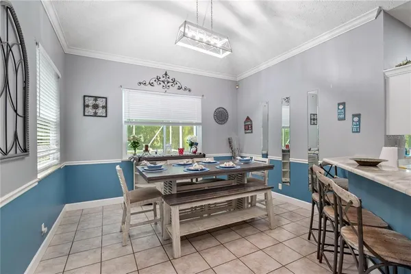 a kitchen with a white cabinets and white appliances
