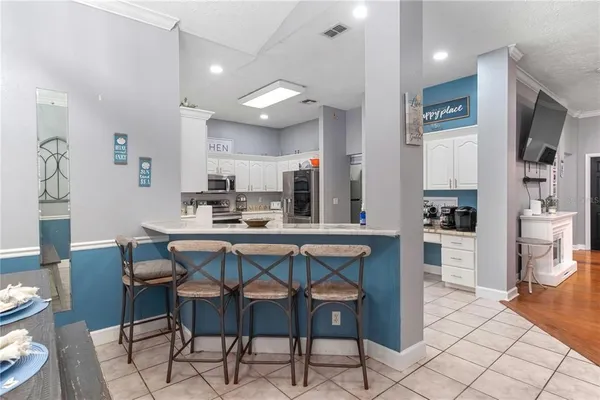 a kitchen with a sink dishwasher and cabinets