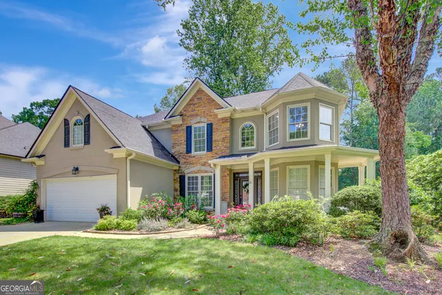 front view of a house with a yard