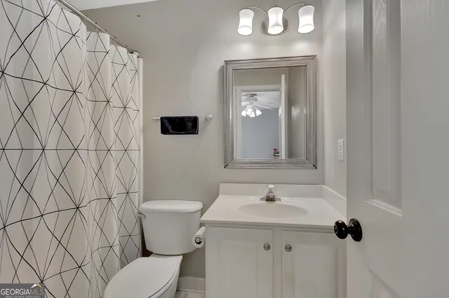 a bathroom with a bathtub a sink a window and a mirror