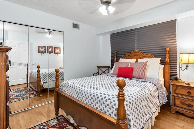 a bedroom with a bed and dresser