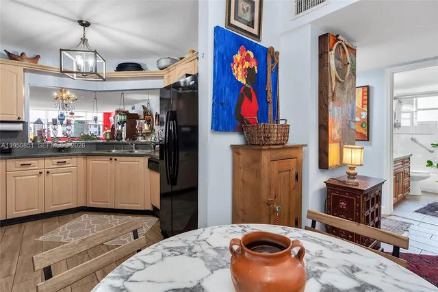 a kitchen with stainless steel appliances granite countertop a stove and cabinets