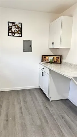 a view of cabinets with wooden floor