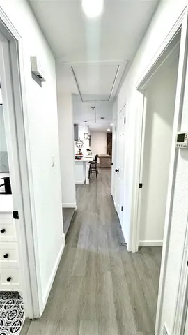 a view of a kitchen from the hallway