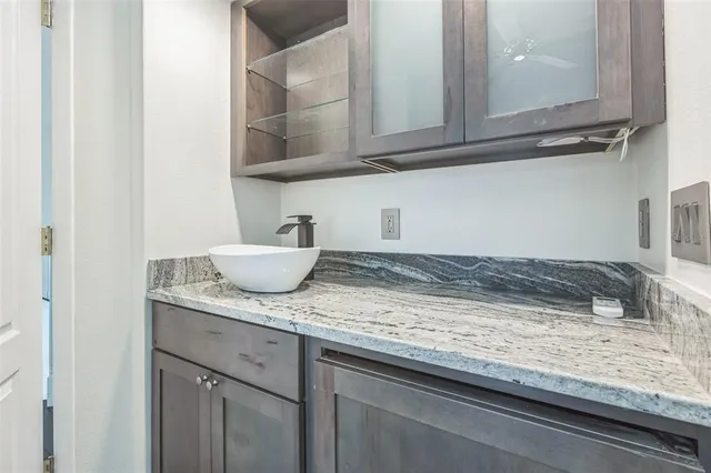 a bathroom with a double vanity sink toilet and a mirror