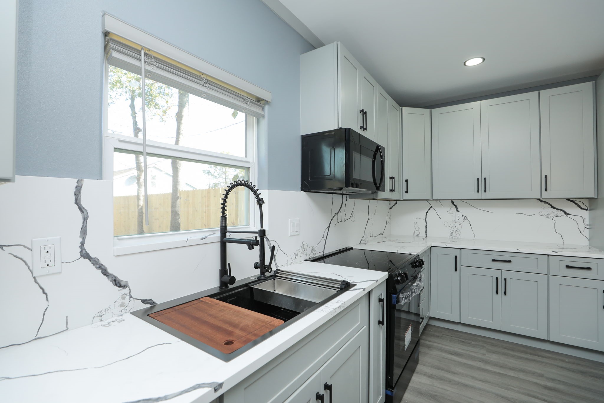 4047 Juliet Street Houston, TX 77087 - Photo 14 of 38 a kitchen with a sink appliances and cabinets