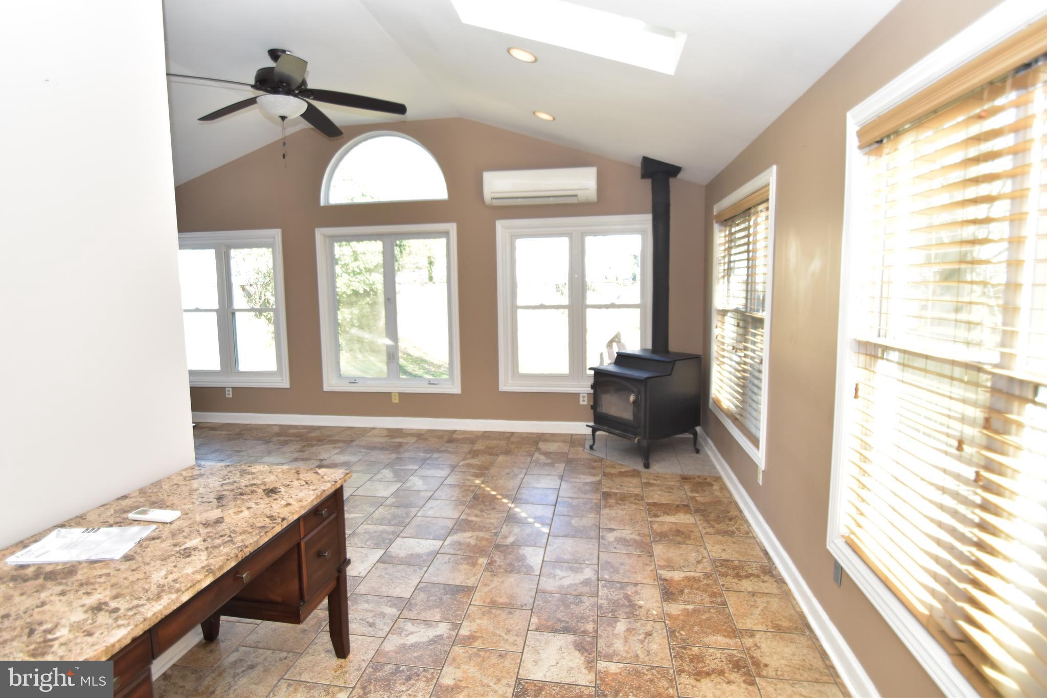 22 Tanglewood Road Baltimore, MD 21228 - Photo 11 of 25 Exceptional family room w/skylights & woodstove