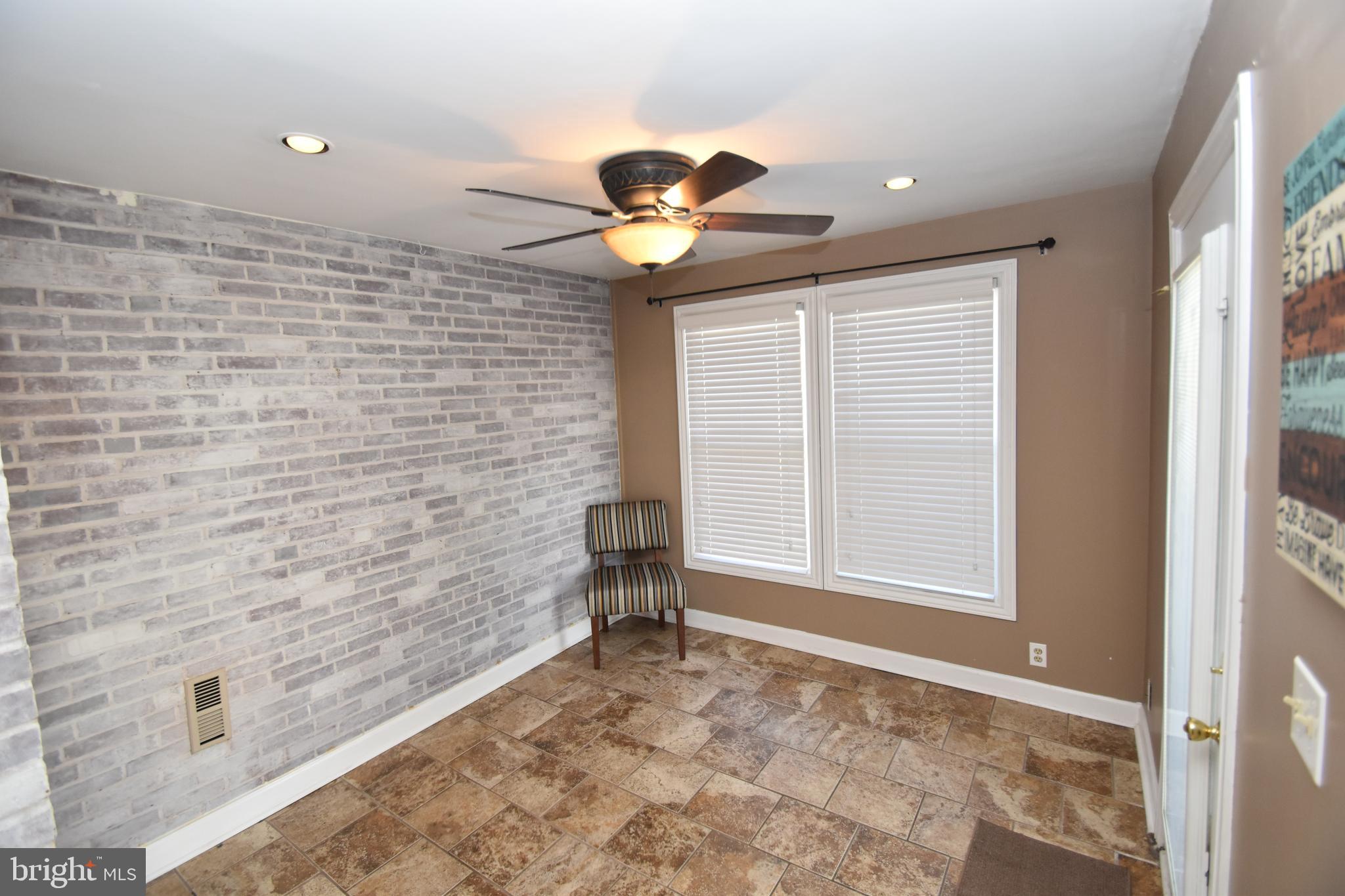 22 Tanglewood Road Baltimore, MD 21228 - Photo 15 of 25 White washed wall in this perfect den w/door