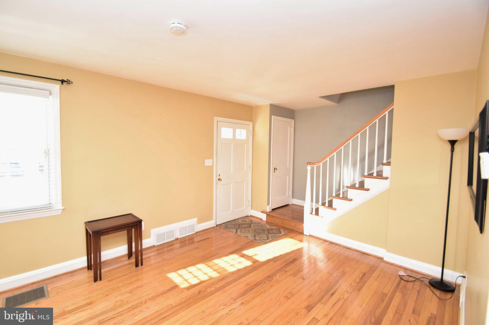 22 Tanglewood Road Baltimore, MD 21228 - Photo 5 of 25 Bright/cheerful living room w/exposed HW