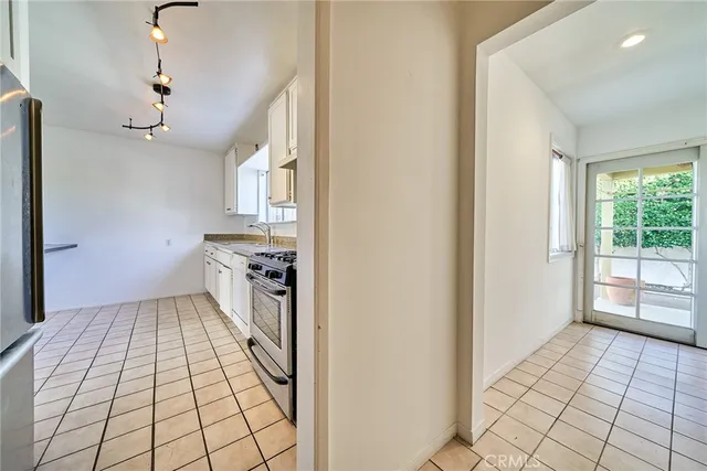 a view of a kitchen & window with a kitchen