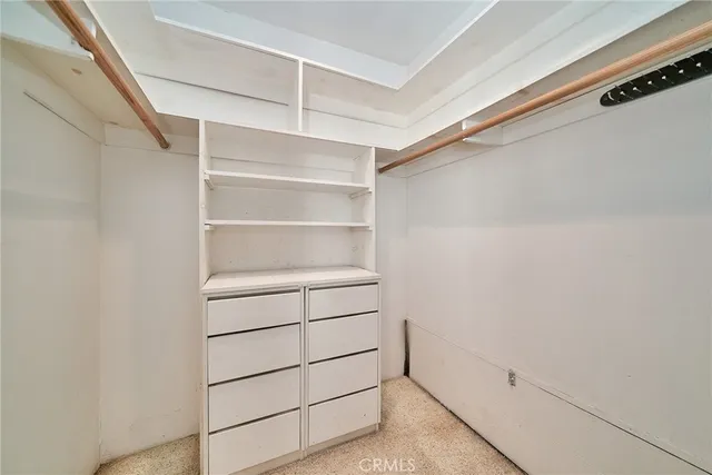 a view of an empty walk in closet