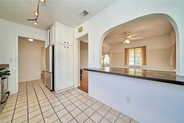 a large bathroom with a glass door shower and a sink