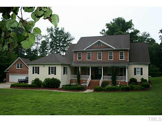 1421 Lakewind Court Raleigh, NC 27603 - Photo 1 of 24 'The Lake House' Gorgeous Custom Built Home- Front of the house faces East - Perfect Feng Shui - capturing the morning sunlight. In the evenings the front door lines up with the stars of 'Orion's Belt' Exterior Back