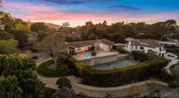 a view of a water fountain in front of the house
