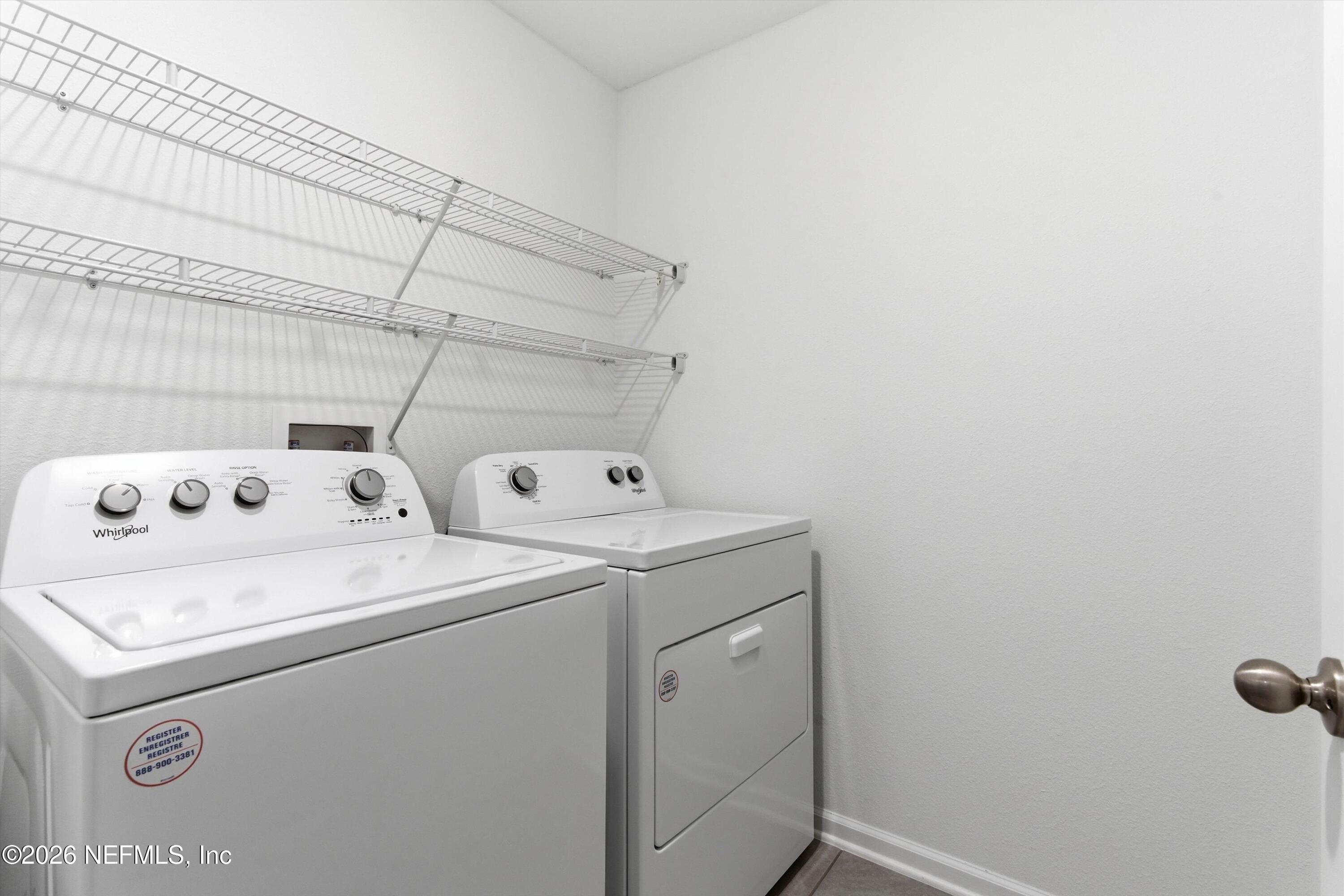 103 Seaport Breeze Road St. Augustine, FL 32095 - Photo 25 of 44 a utility room with dryer and washer
