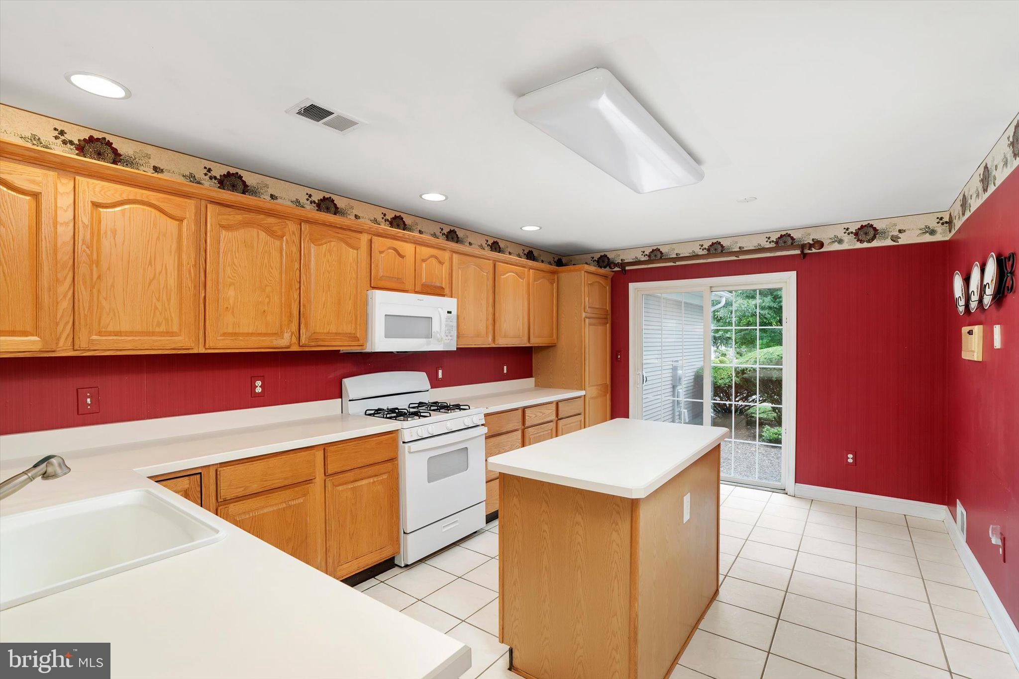 132 Coburn Road Pennington, NJ 08534 - Photo 22 of 50 Bright kitchen with warm wood accents.