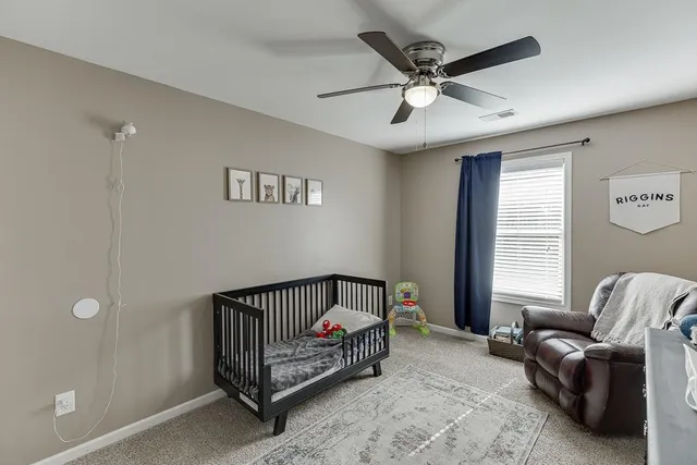 a bedroom with furniture and windows