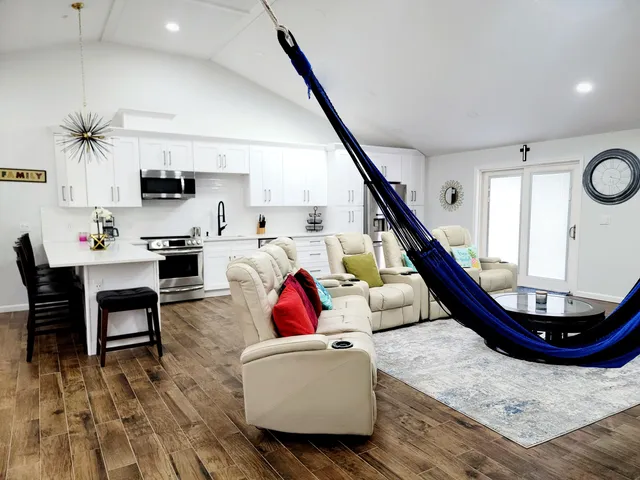 a living room with furniture and a flat screen tv