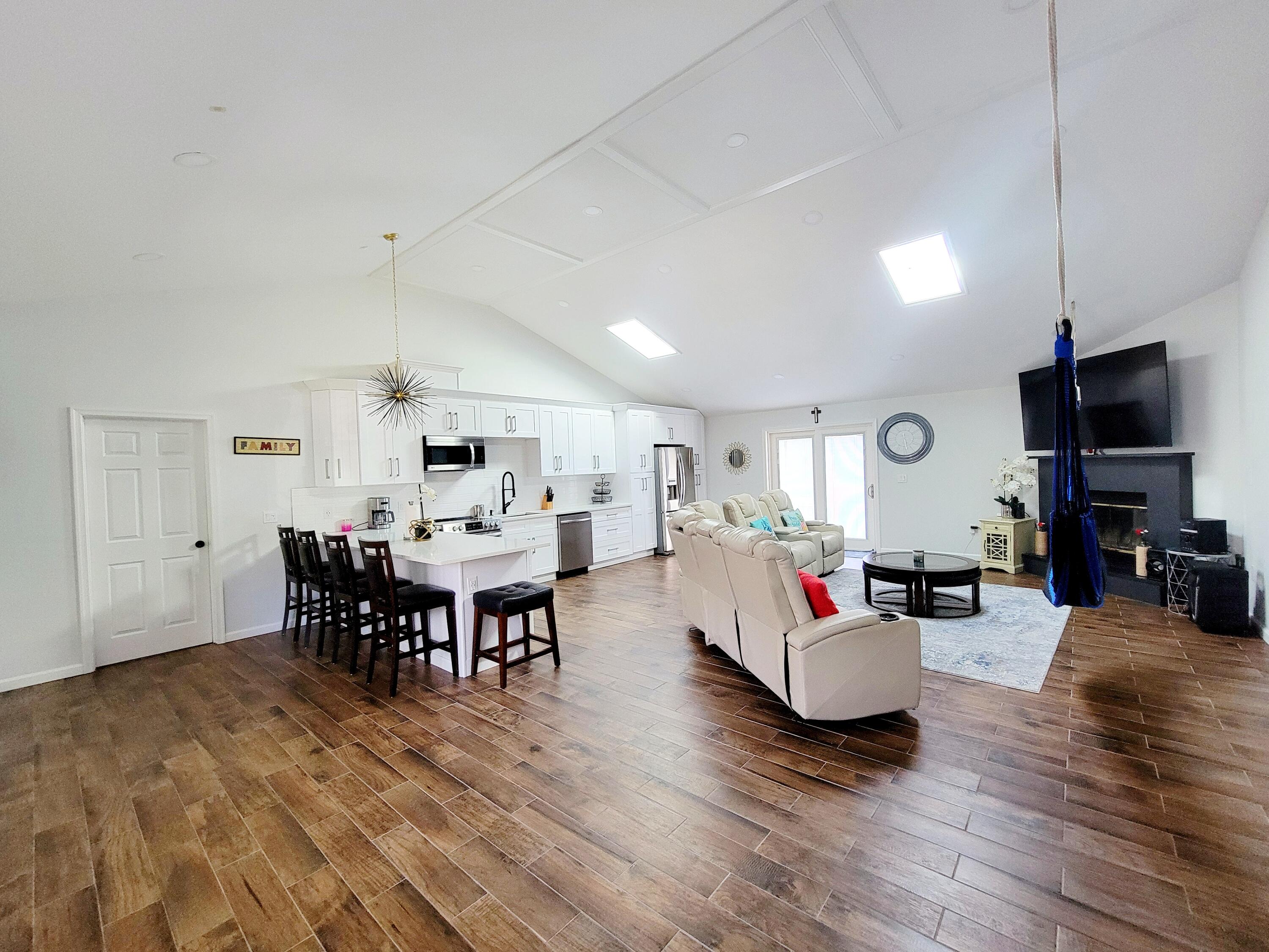 6395 Cherokee Trail Tobyhanna, PA 18466 - Photo 18 of 48 a living room with furniture dining table and a flat screen tv