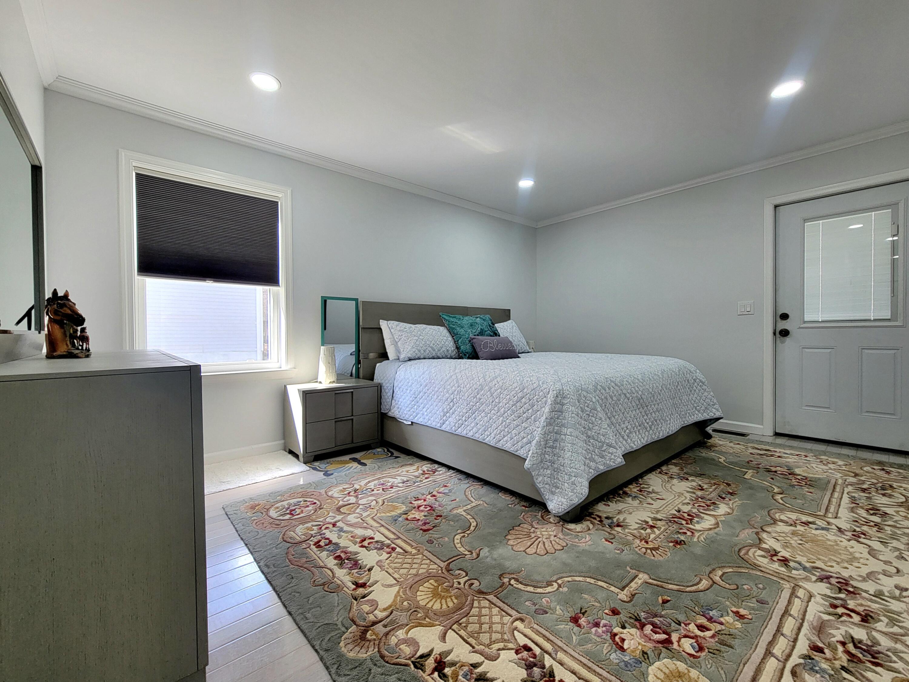 6395 Cherokee Trail Tobyhanna, PA 18466 - Photo 23 of 48 a bedroom with a large bed and a flat screen tv