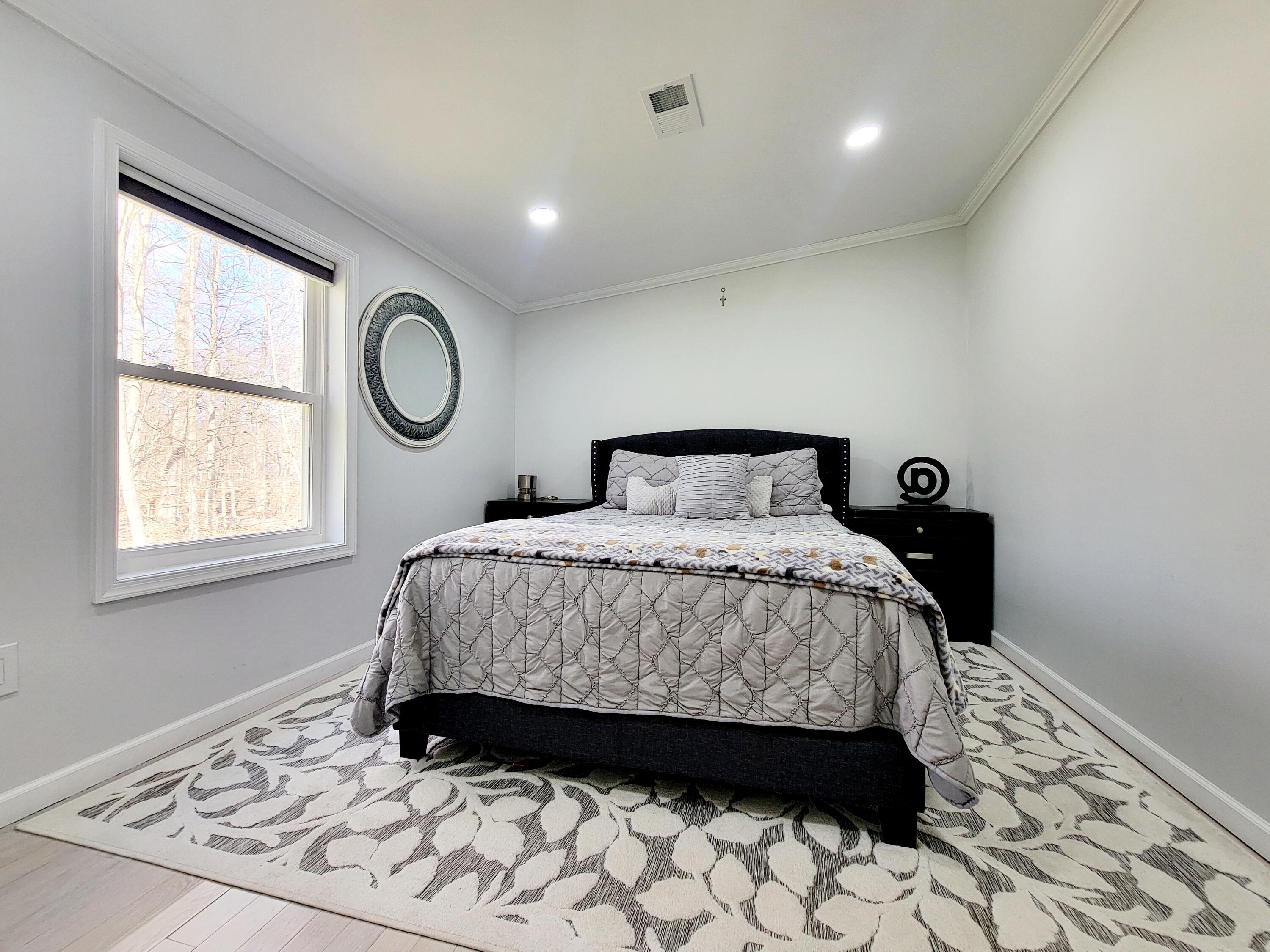 6395 Cherokee Trail Tobyhanna, PA 18466 - Photo 24 of 48 a bedroom with a bed and a window