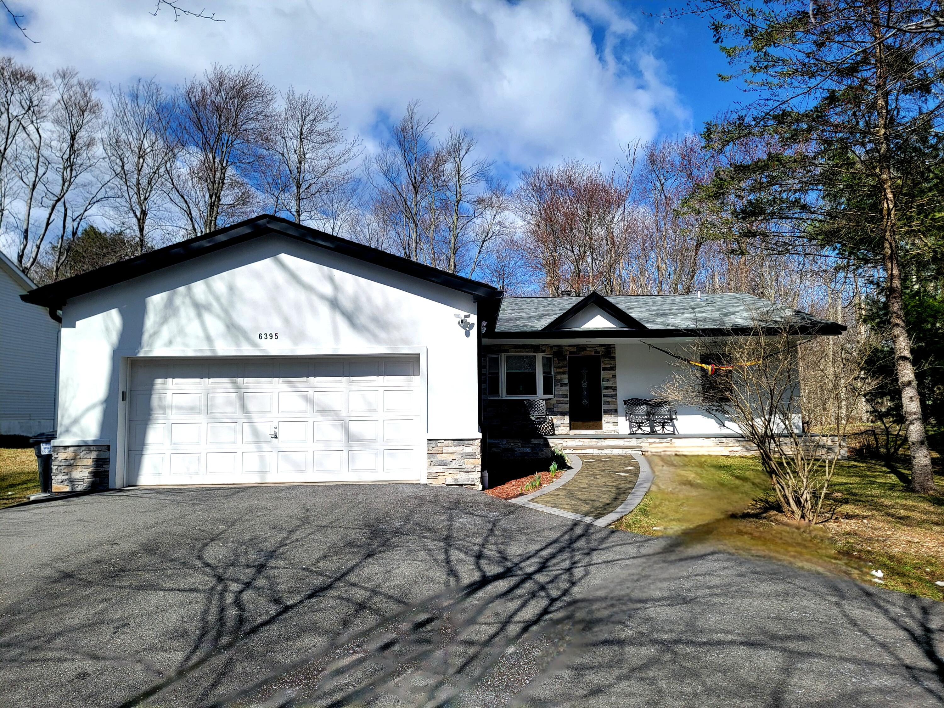 6395 Cherokee Trail Tobyhanna, PA 18466 - Photo 33 of 48 a view of a house with backyard and sitting area