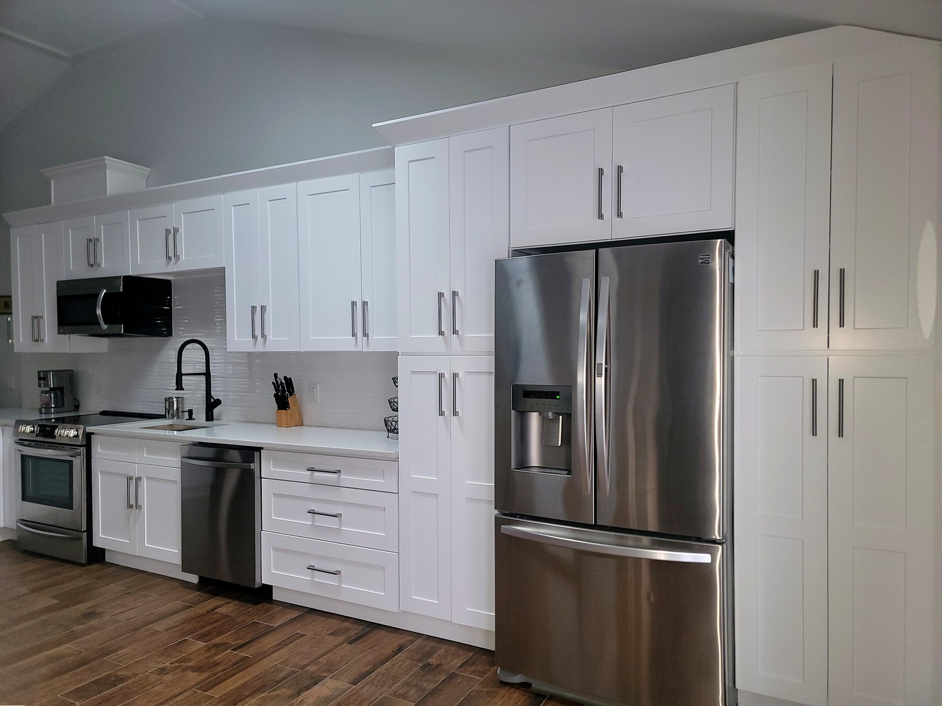 6395 Cherokee Trail Tobyhanna, PA 18466 - Photo 8 of 48 a kitchen with stainless steel appliances white cabinets and a refrigerator