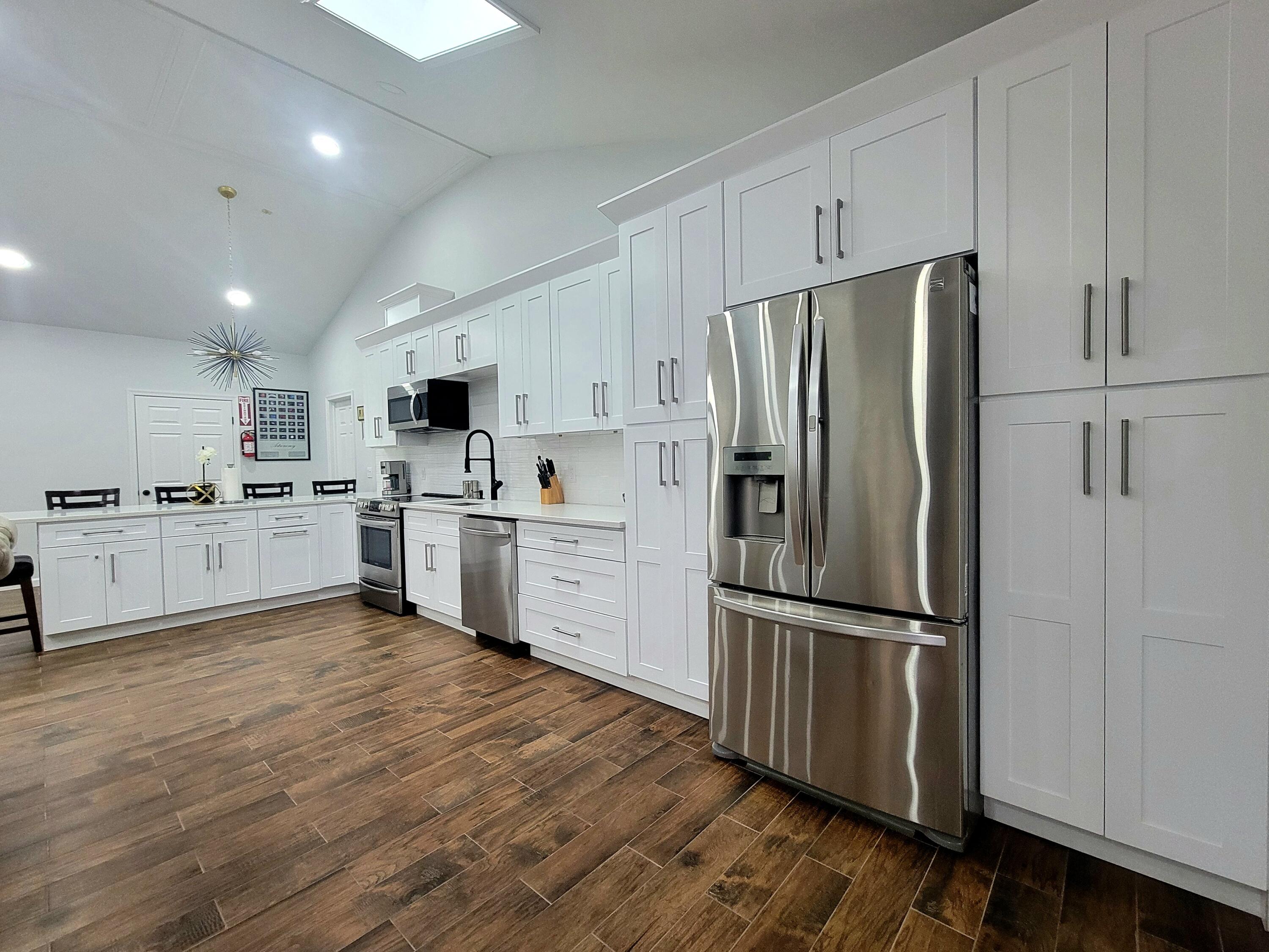 6395 Cherokee Trail Tobyhanna, PA 18466 - Photo 9 of 48 a kitchen with white cabinets and stainless steel appliances